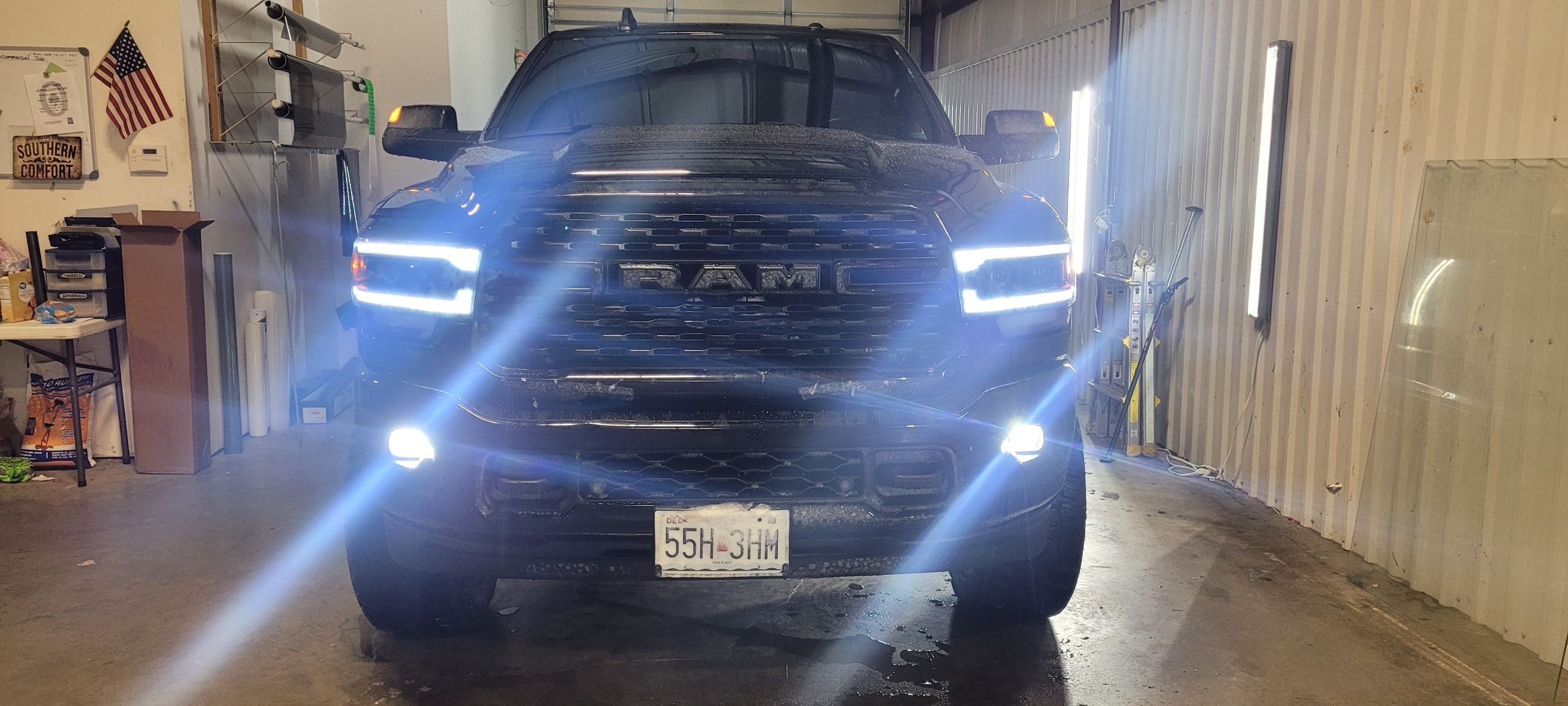 Black Ram 1500 with LED headlights in the Tint Clinic shop